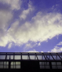 Low angle view of built structure against cloudy sky