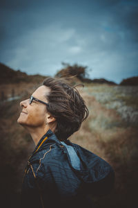 Portrait of young woman looking away