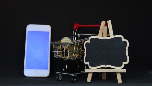 Close-up of laptop on table against black background