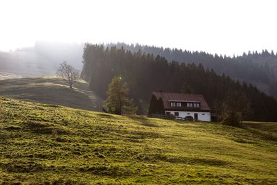 House on field against sky