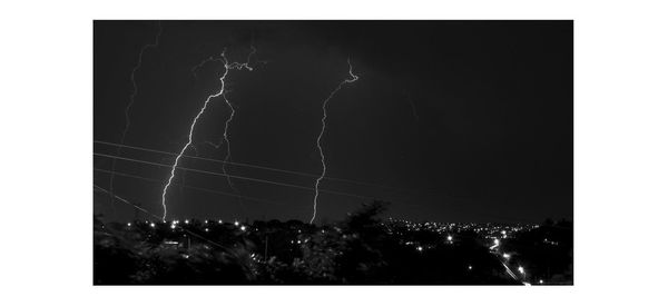 Low angle view of lightning in sky at night