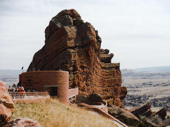 Entrance of red rocks amphitheatre against sky