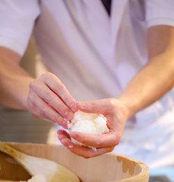 Close-up of hand holding ice cream