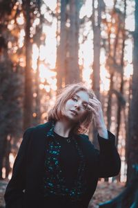 Portrait of young woman in forest