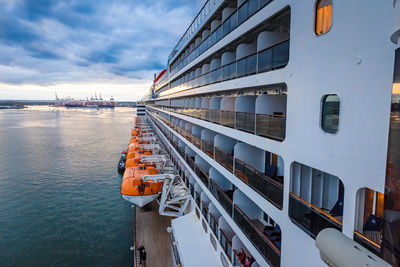 Panoramic view of pier by sea against sky in city