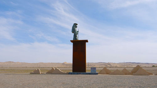 Low angle view of statue against sky