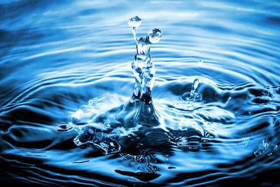 Close-up of drop splashing in water