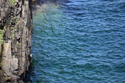 High angle view of rocks in sea