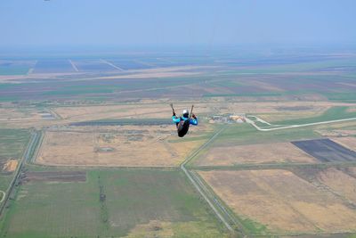 View of person paragliding mid-air