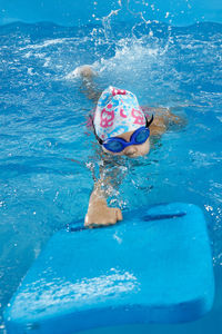 Boy swimming in sea