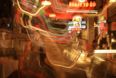 Blurred motion of illuminated carousel at night