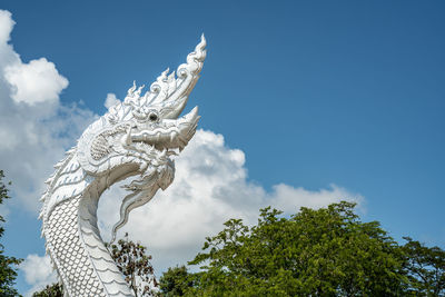 Low angle view of statue against sky