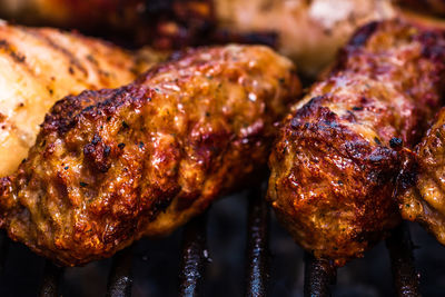 Close-up of meat on barbecue grill