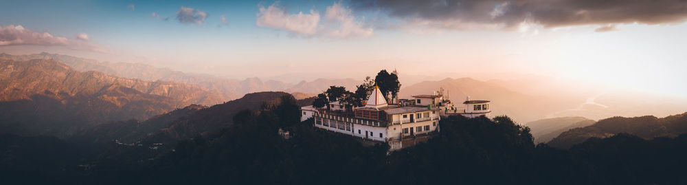 Panoramic view of buildings against sky during sunset