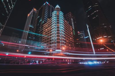 Illuminated modern buildings in city at night