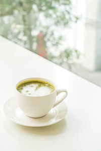 Close-up of coffee cup on table