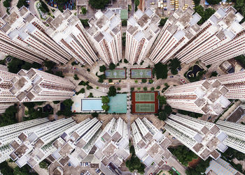 Buildings with swimming pool and sports court in city