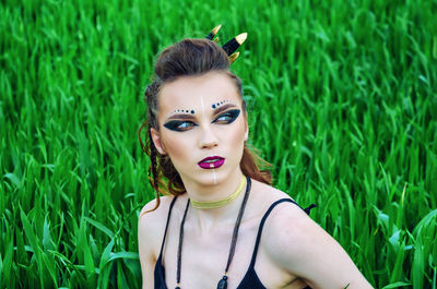 Portrait of young woman in grass