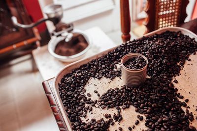High angle view of coffee beans in tray on table