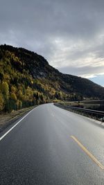 Empty road against sky