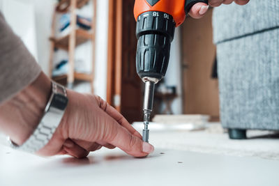 Cropped hand of person working in workshop