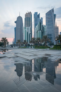 Reflection of buildings in swimming pool