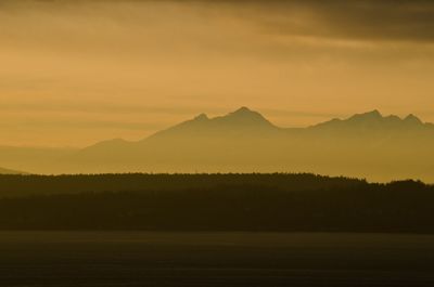 Scenic view of mount ellinor against orange sky