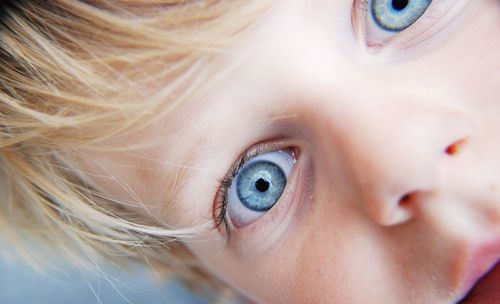 Close-up portrait of boy with blue eyes