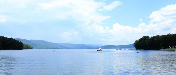 River with mountains against cloudy sky