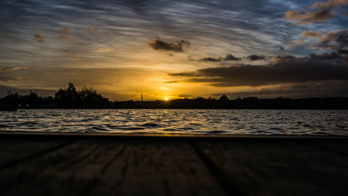 Scenic view of sea against orange sky