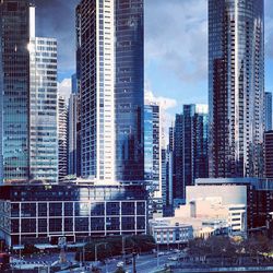 Modern buildings in city against sky