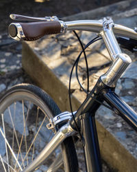 Beautiful dark blue city bike with metallic details and leather saddle and grips in retro style