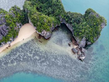 High angle view of rocks by sea