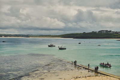 Scenic view of boats and sea against sky in st ives, cornwall - england