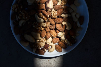 High angle view of nuts in plate on table
