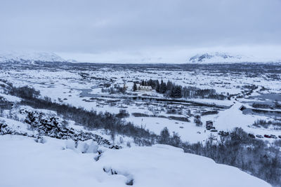 Scenic view of snow covered mountains against sky