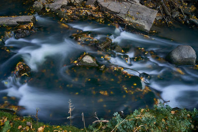High angle view of stream flowing in lake