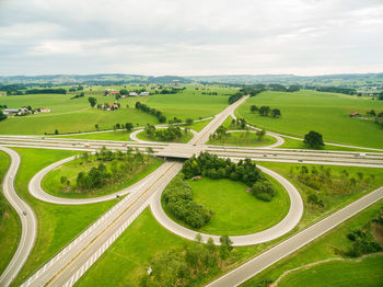 High angle view of agricultural field against cloudy sky