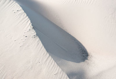 High angle view of sand dunes at beach