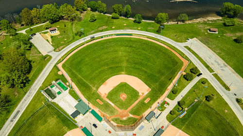 A hot summer day with a public park in green bay wisconsin and its baseball field