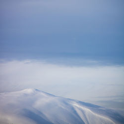 Scenic view of snowcapped mountain against sky