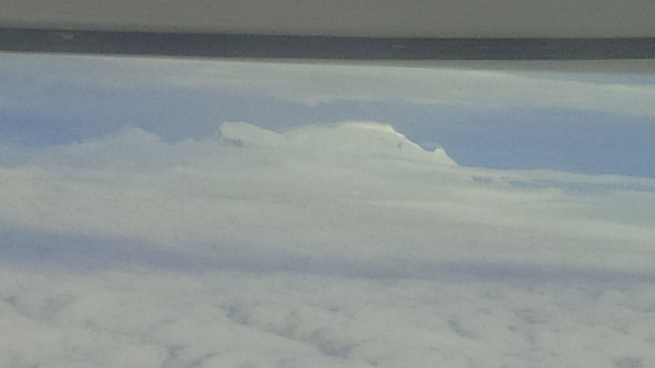 AERIAL VIEW OF CLOUDS OVER LANDSCAPE