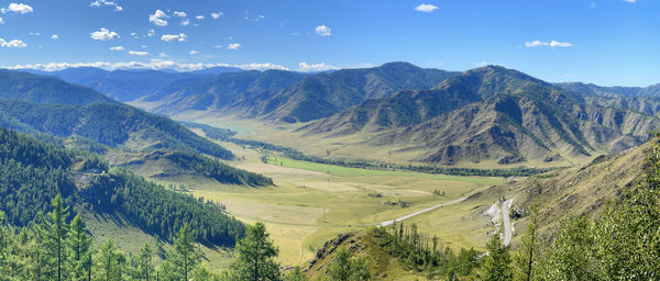 Panoramic view of the mountain plateau and the the road winds along it in altay, russia