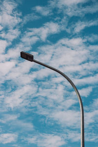 Low angle view of street light against sky