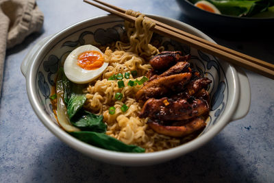 High angle view of ramen noodles served on table