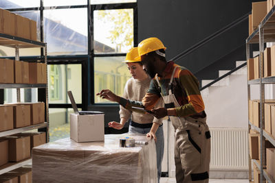 Side view of man working at construction site