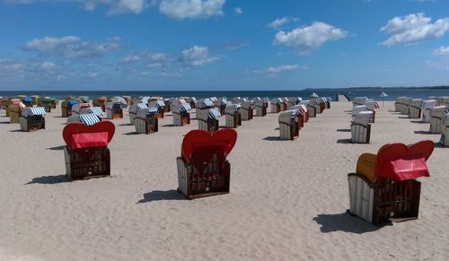 People on beach against sky