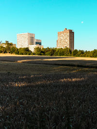 Buildings against clear sky in city