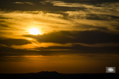 Scenic view of dramatic sky over sea during sunset