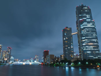 Illuminated buildings in city at night